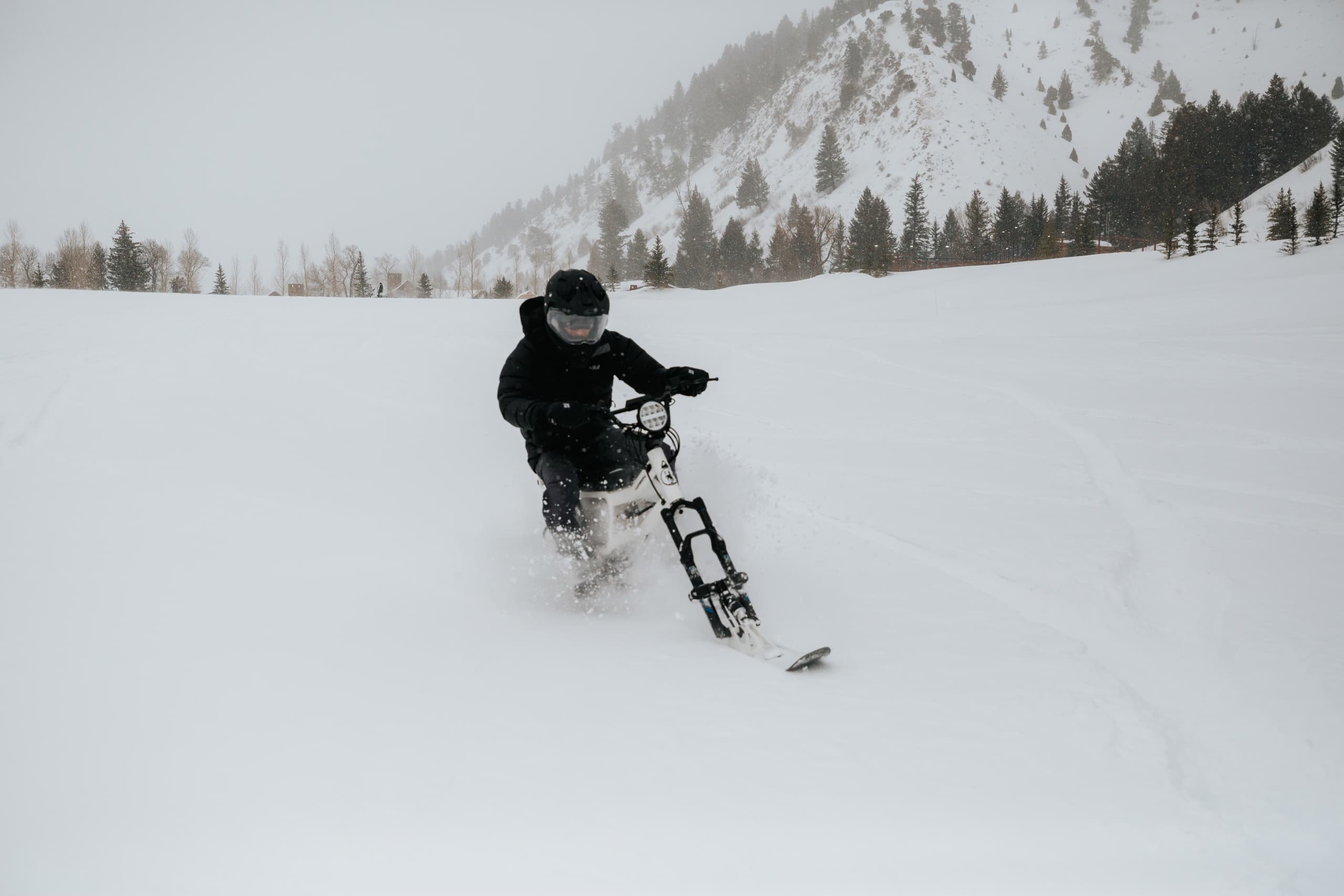 riding a moonbike through snow