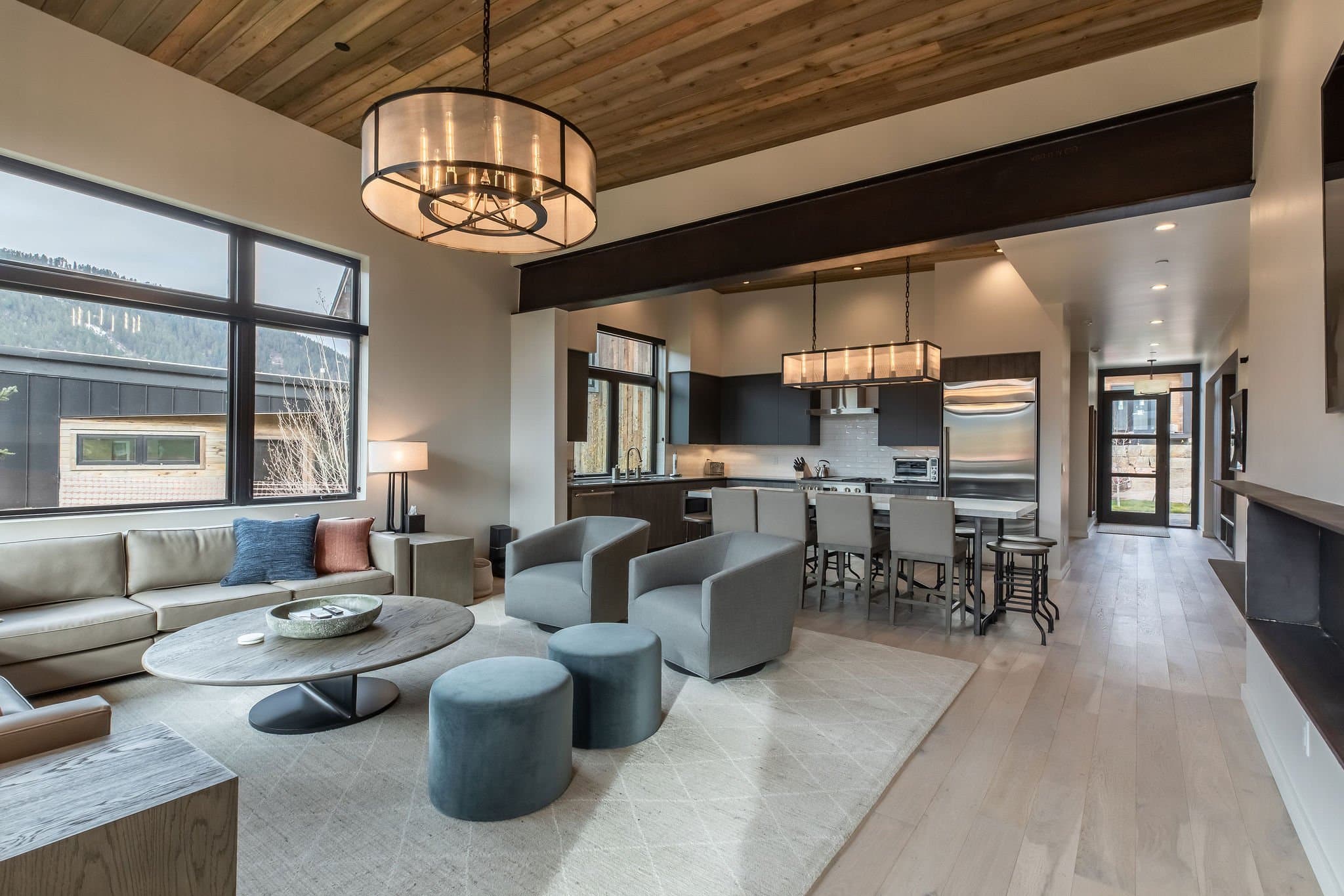 The living and kitchen area of the Meadow Cabin at Snake River Sporting Club in Jackson, WY.