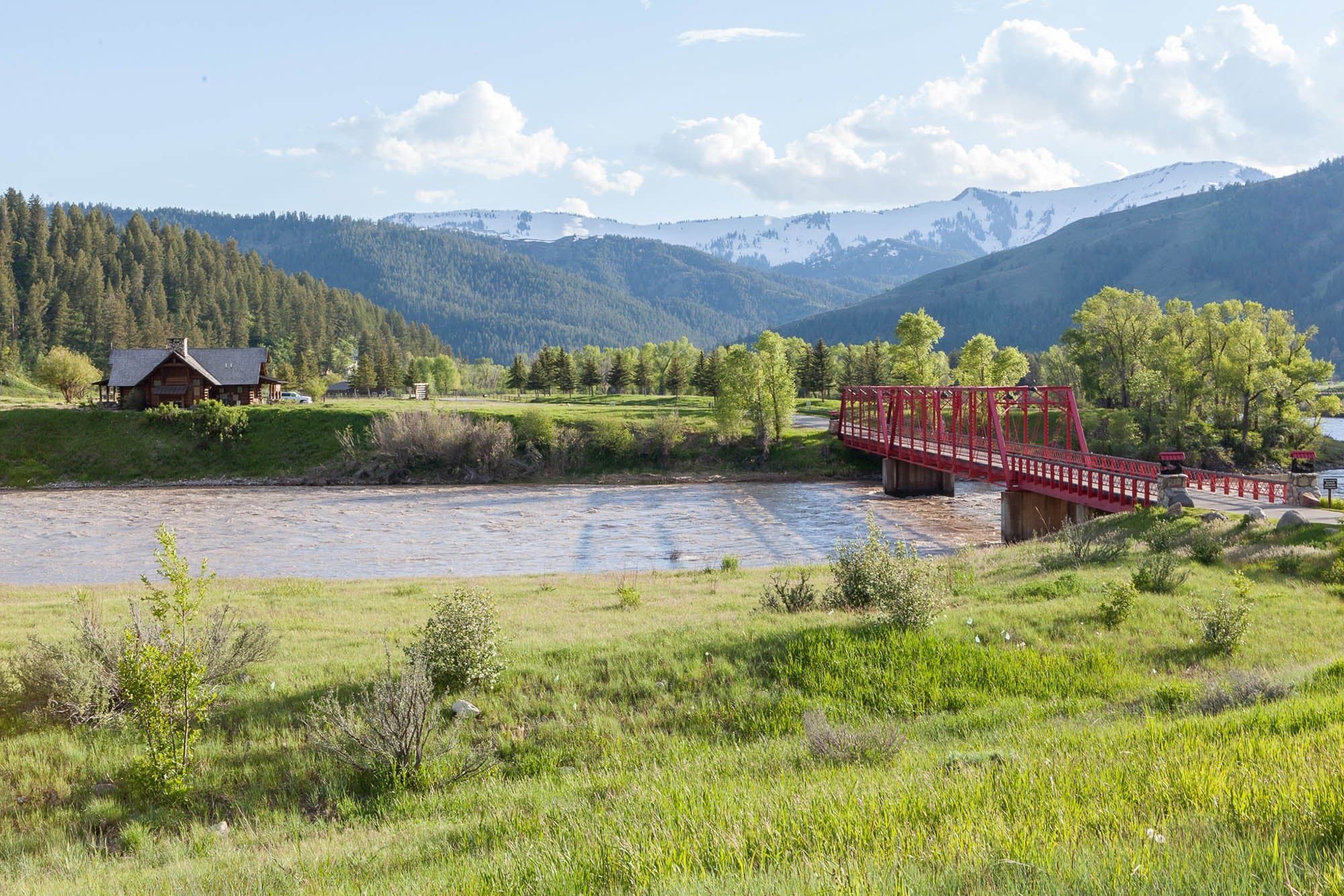 A red bridge over a river