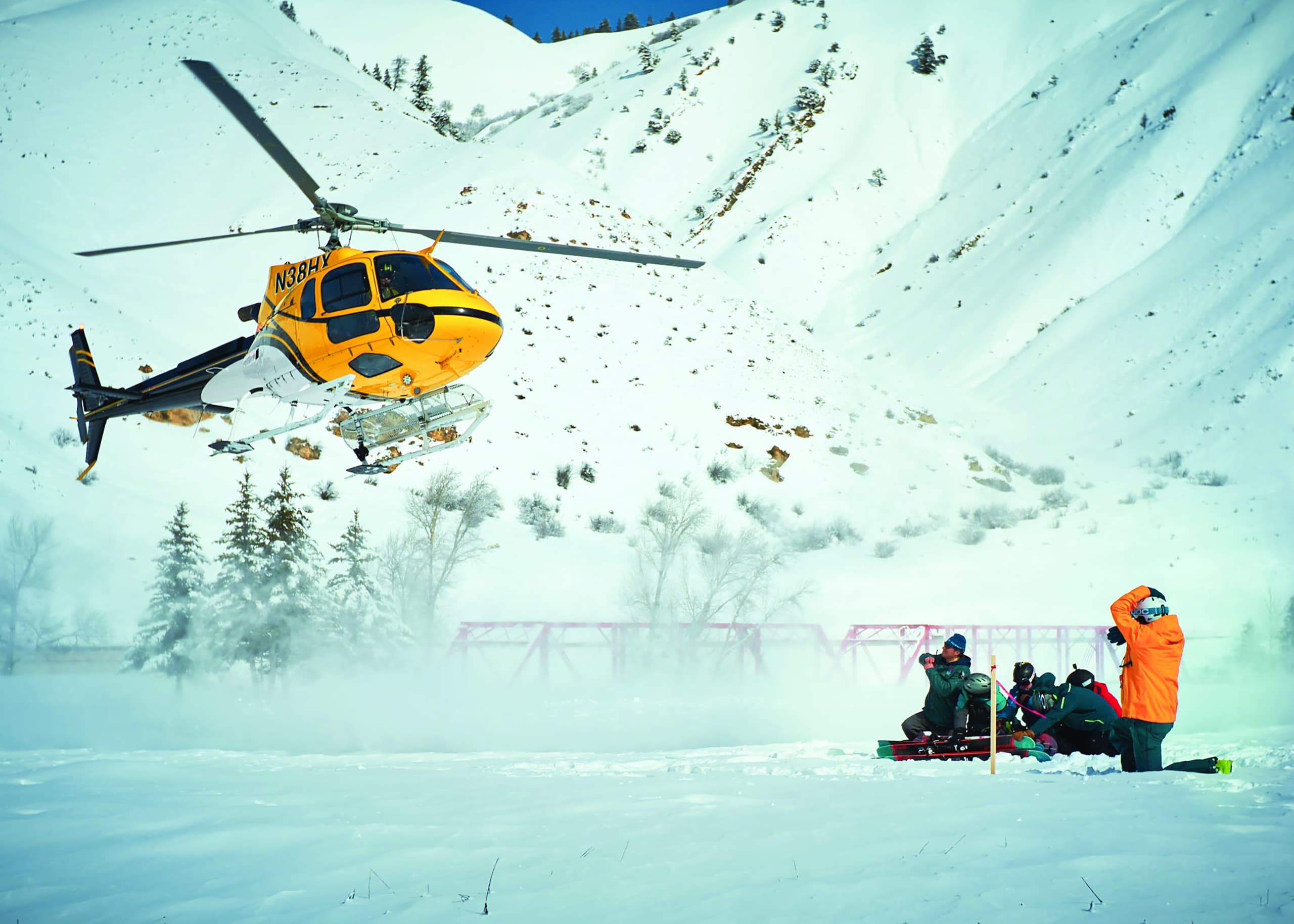Helicopter landing at Snake River Sporting Club for Heliskiing tour in Wyoming