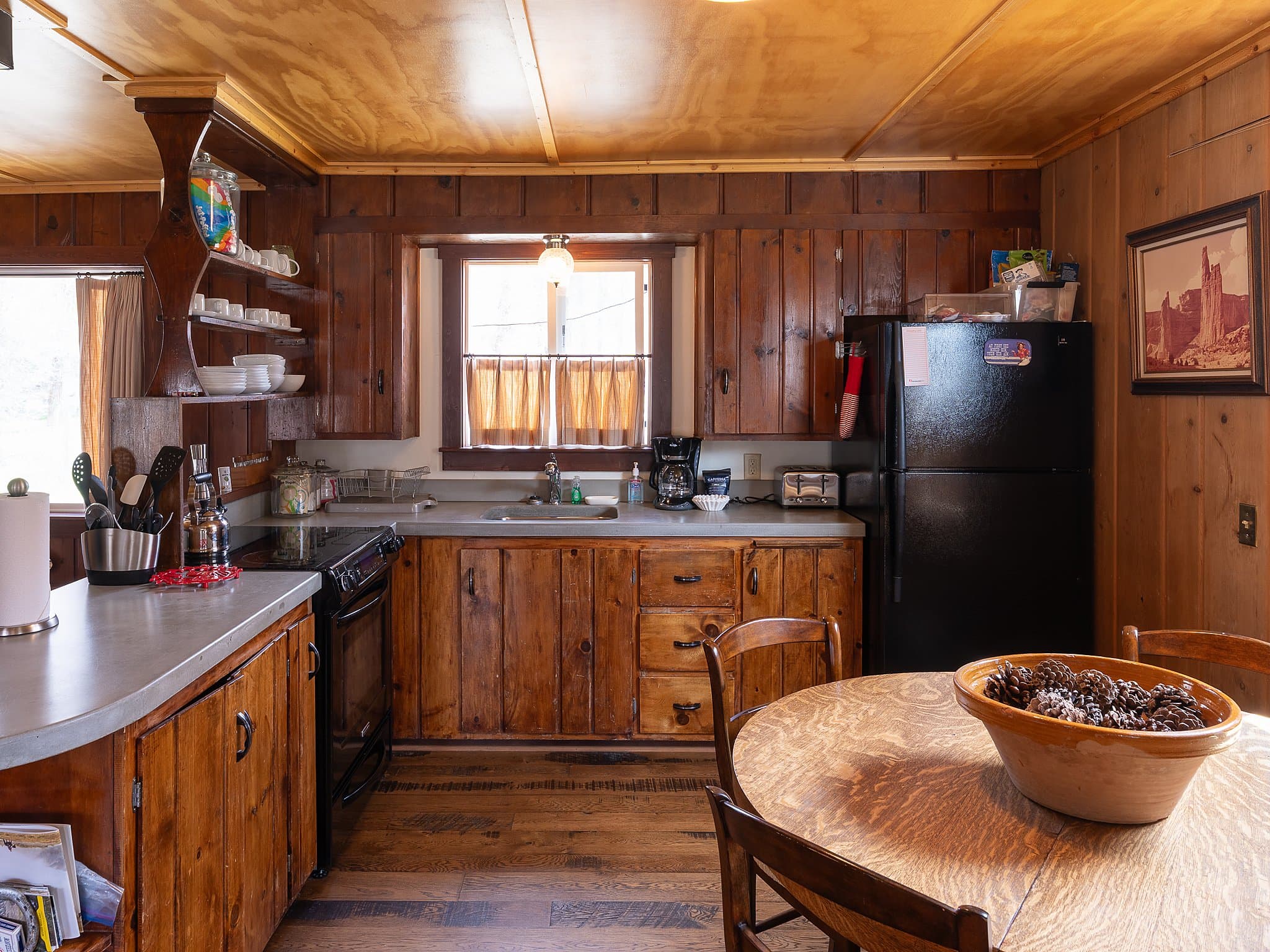 Rustic knotty pine kitchen in a hunting and fishing cabin at Snake River Sporting Club in Jackson Hole, Wyoming
