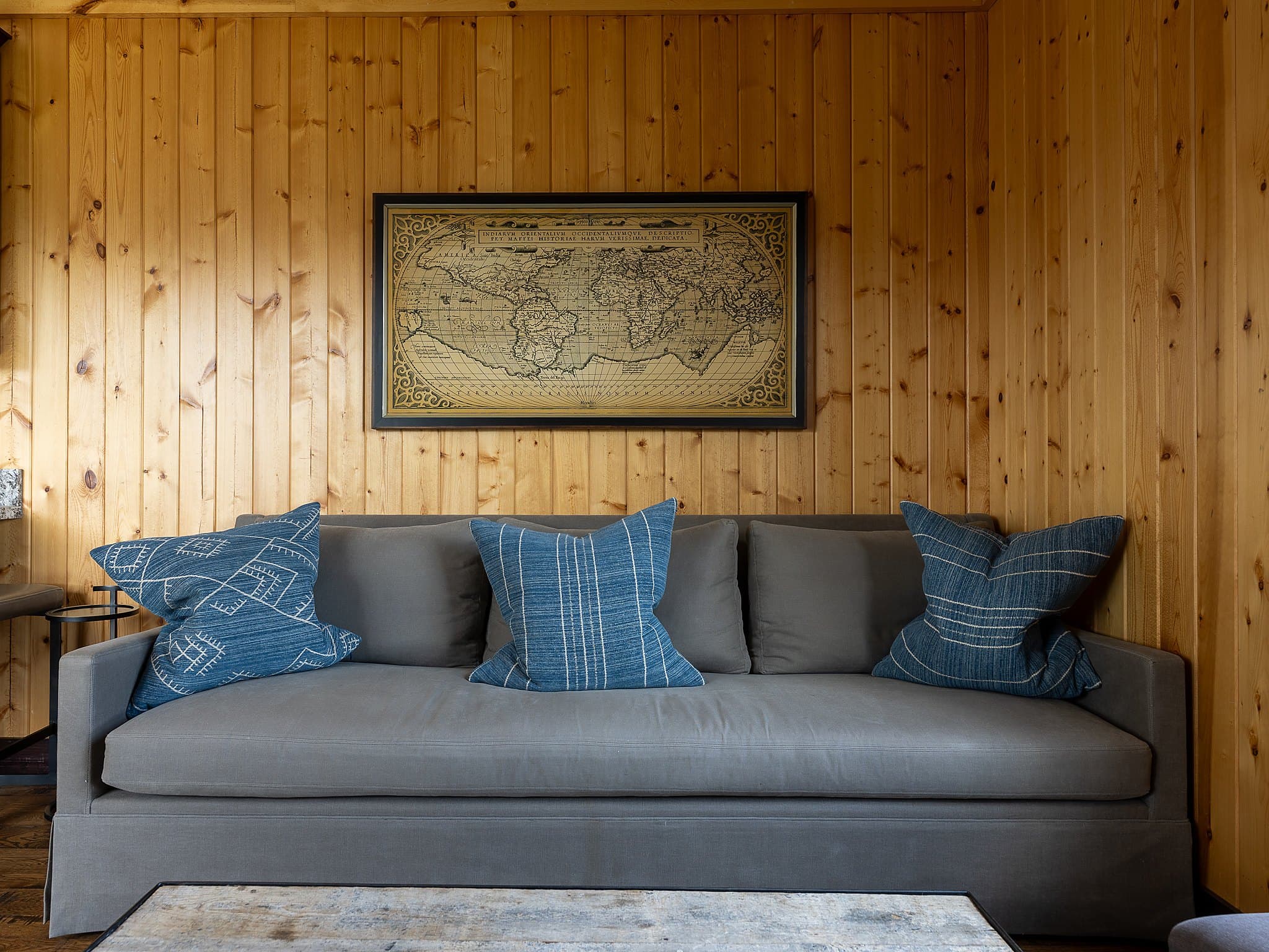 Cozy cabin living room with vintage map art at Snake River Sporting Club