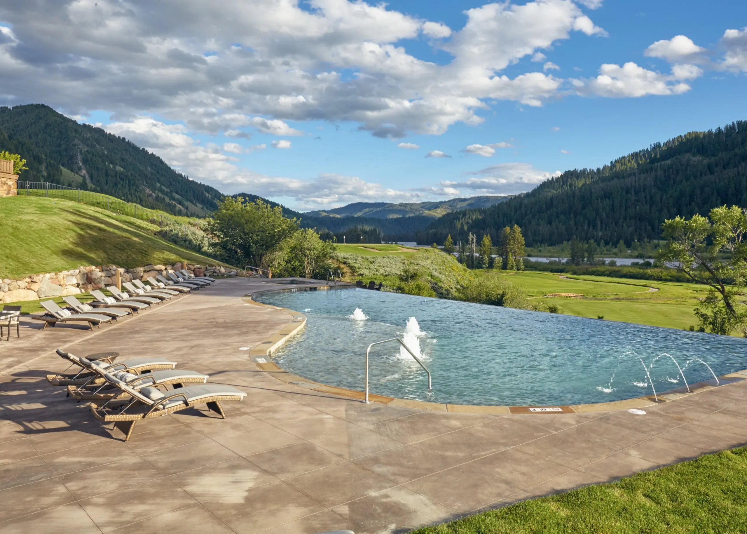 outdoor pool area overlooking mountain view at Snake River Sporting Club in Wyoming