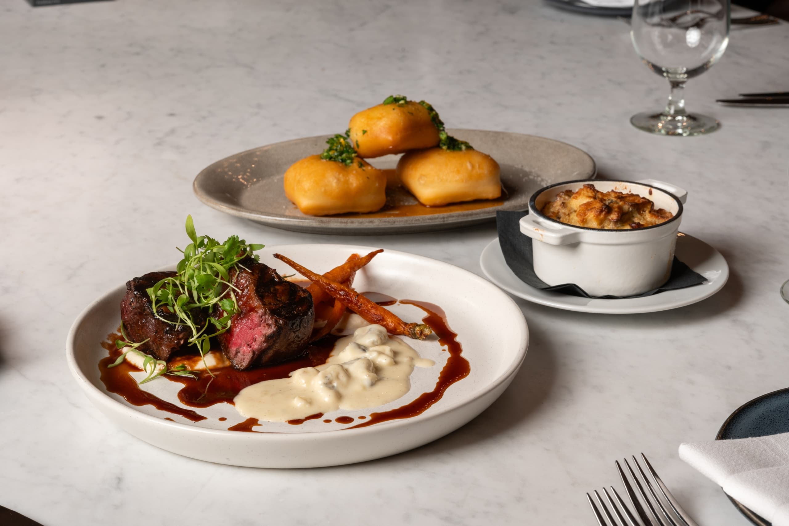 Plates from Snake River Sporting Club's winter dining menu.