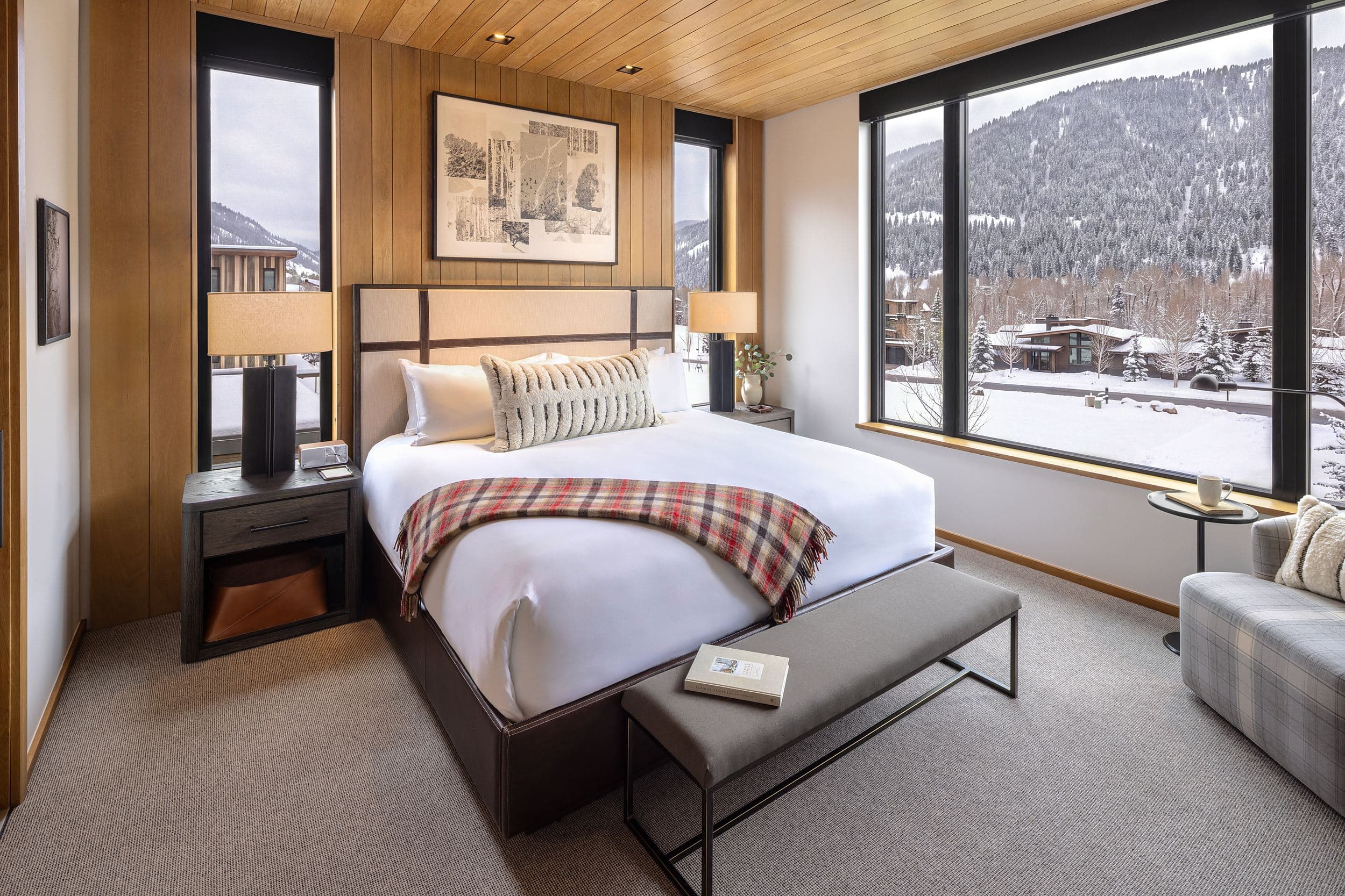 Guest room with king bed and snowy mountain views at Snake River Sporting Club in Jackson Hole, Wyoming