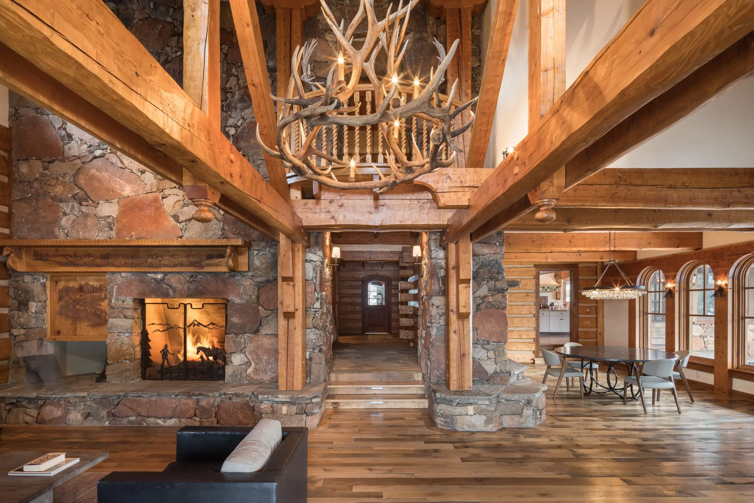 A rustic luxury cabin with an antler chandelier at Snake River Sporting Club